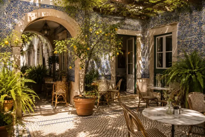 Courtyard of a restored townhouse with arches